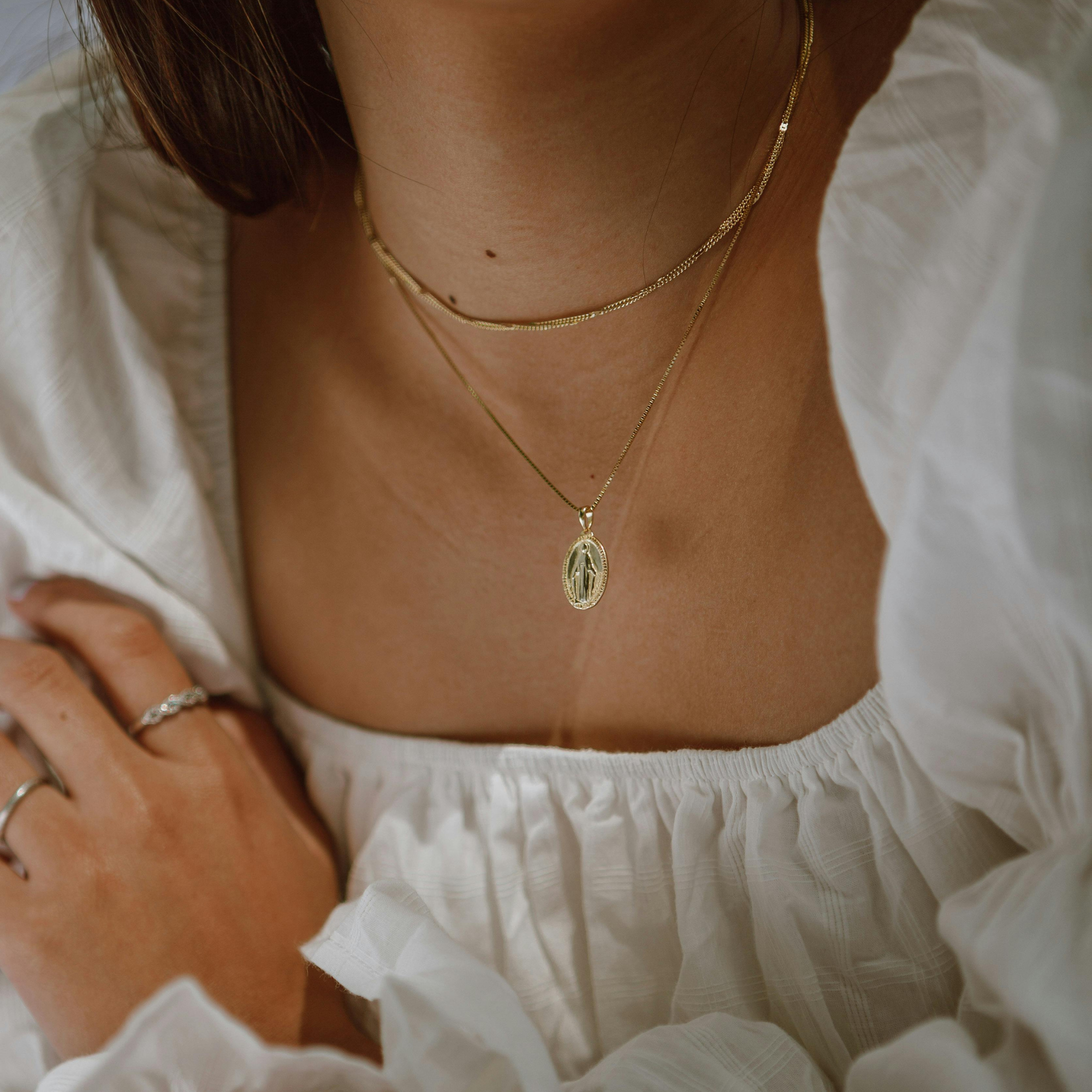 Layered gold necklace with delicate pendant, minimalist necklace collection