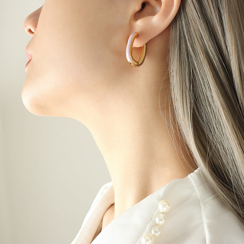 Gold PVD plated stainless steel U-shaped earrings with glossy enamel color accent, modern geometric design for women.