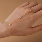 Gold plated 925 sterling silver hand chain bracelet with zirconia accents, adjustable finger bracelet design