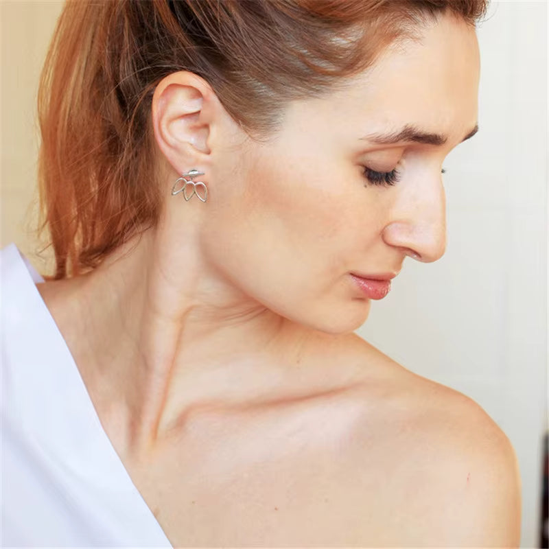 Stainless steel geometric flower petal stud earrings for women, minimalist design, 1.8 × 1.8 cm size, lightweight fashion jewelry.