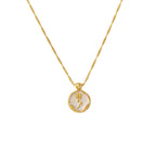 Gold PVD plated stainless steel necklace with round zircon flower pendant, minimalist floral design displayed on chain.