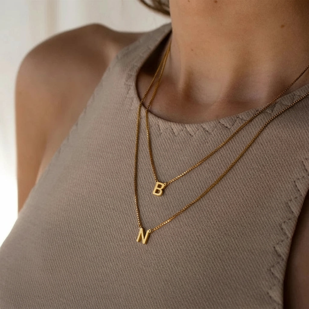 Gold plated stainless steel letter pendant necklace with 42+8 cm chain, minimalist initial jewelry for women.