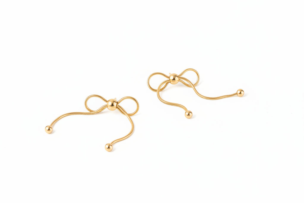 18K gold PVD plated stainless steel bow knot drop earrings with delicate chain design and polished bead accents for women