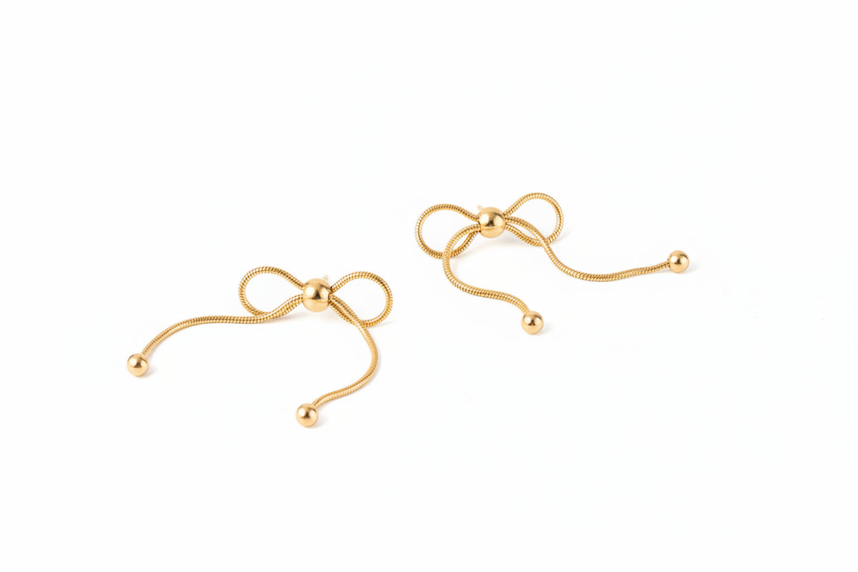 18K gold PVD plated stainless steel bow knot drop earrings with delicate chain design and polished bead accents for women