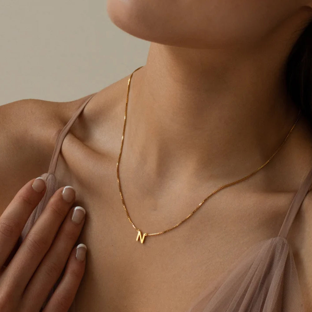 Gold plated stainless steel letter pendant necklace with 42+8 cm chain, minimalist initial jewelry for women.