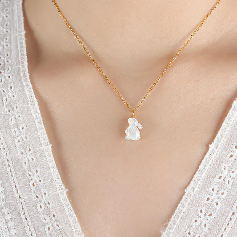 18K gold plated stainless steel rabbit shell pendant necklace with natural shell charm and adjustable link chain on white background