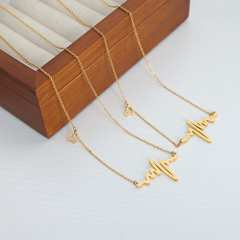 18K gold plated stainless steel heartbeat pendant necklace with geometric pulse design and adjustable link chain on white background