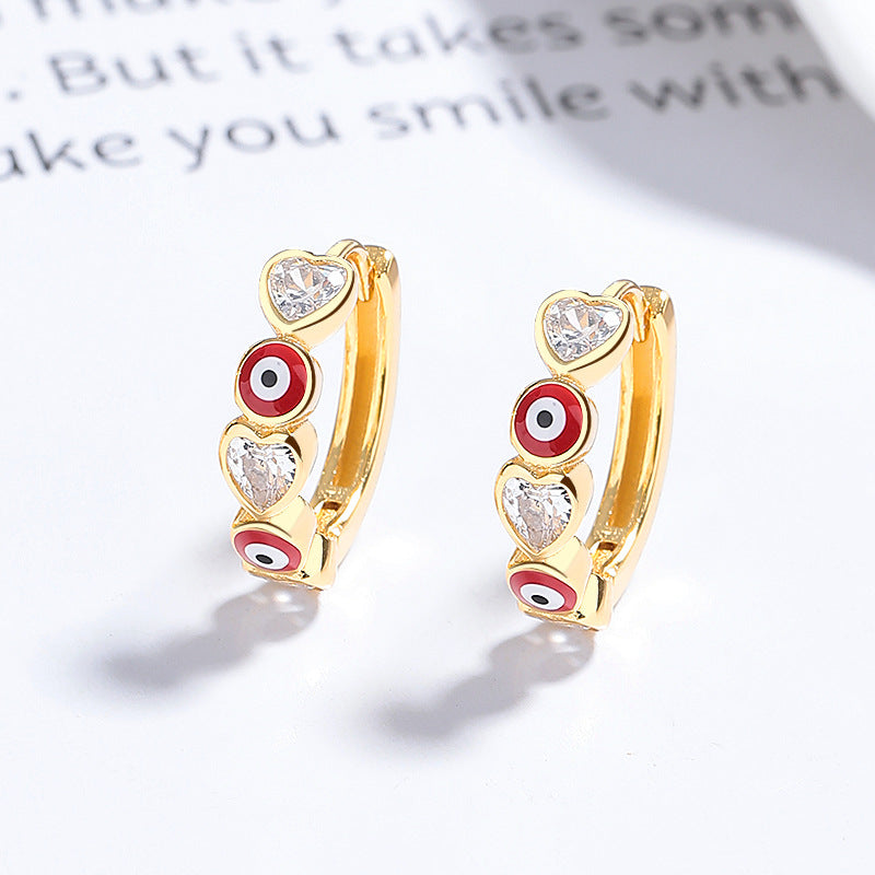Gold plated 925 sterling silver evil eye hoop earrings with blue and red zircon heart detail