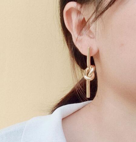 18K gold plated 316L stainless steel knotted earrings for women, trendy minimalist design with polished finish.