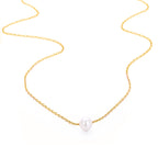 Minimalist stainless steel pearl choker necklace with 5mm pearl pendant, adjustable 15–17 inches chain, worn on model.