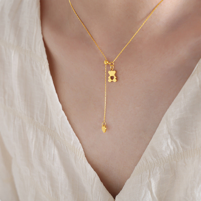 18K gold plated stainless steel bear heart pendant necklace with hollow geometric design and adjustable link chain on white background