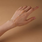 Gold plated 925 sterling silver hand chain bracelet with zirconia accents, adjustable finger bracelet design