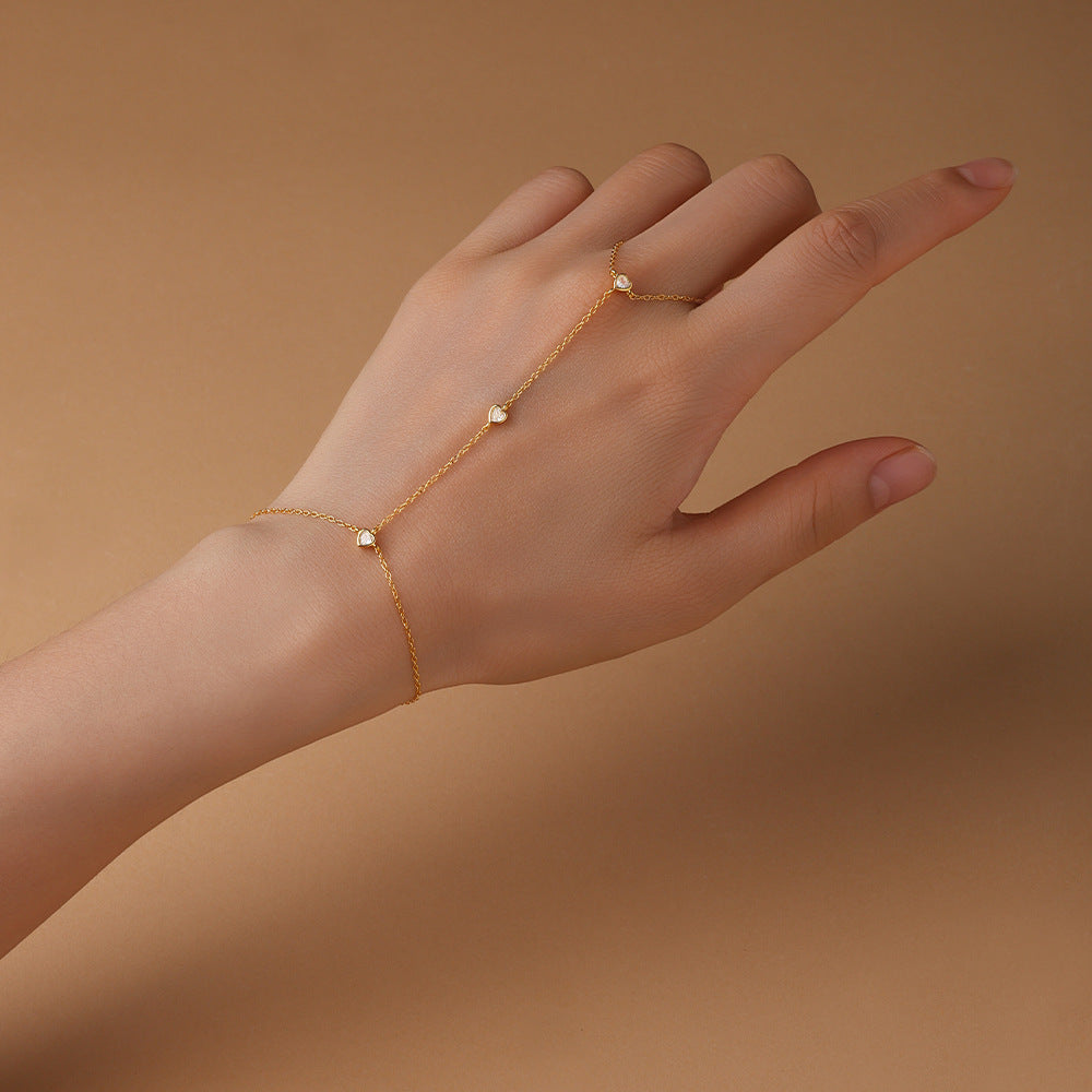 Gold plated 925 sterling silver hand chain bracelet with zirconia accents, adjustable finger bracelet design