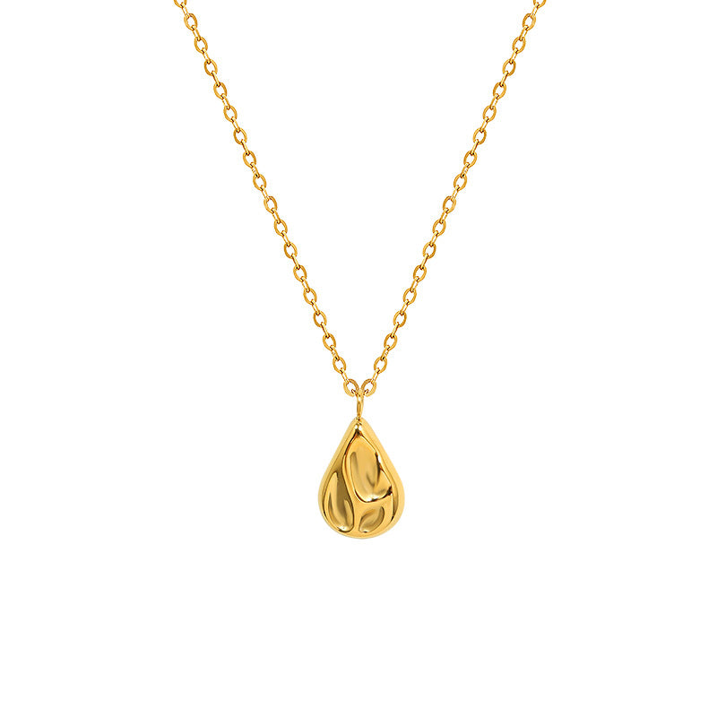 18K gold plated stainless steel water drop pendant necklace with concave geometric design and pearl accent, adjustable chain on white background