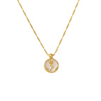 Gold PVD plated stainless steel necklace with round zircon flower pendant, minimalist floral design displayed on chain.