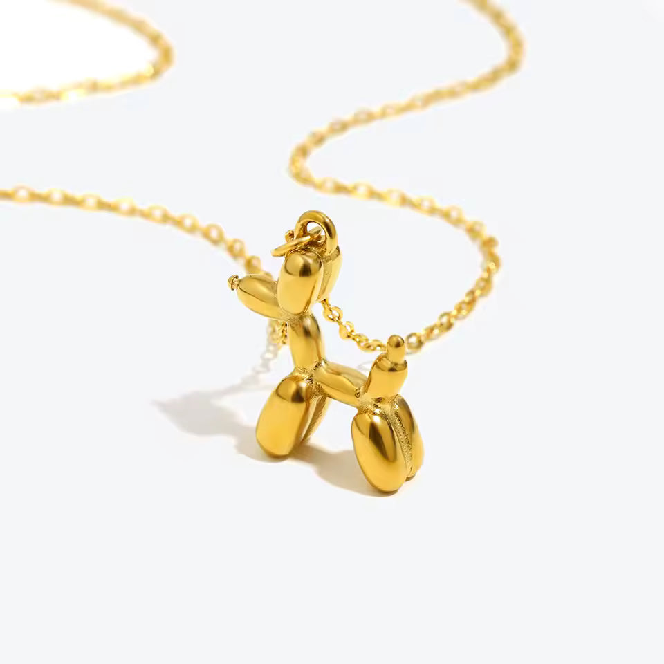 18K gold plated stainless steel balloon dog pendant necklace with cute animal design on a link chain, unisex jewelry on white background