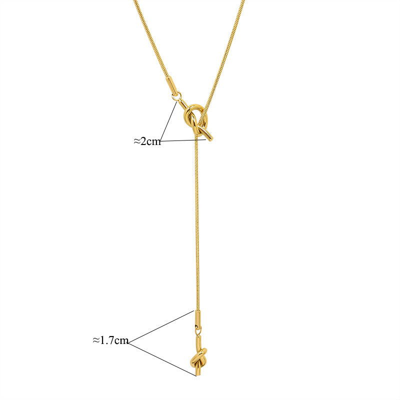 18K gold plated stainless steel knotted pendant necklace with long adjustable chain, geometric trendy women’s jewelry on white background