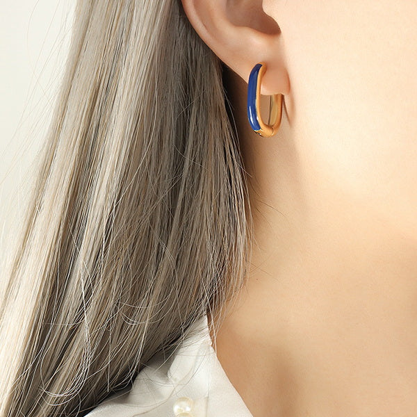 Gold PVD plated stainless steel U-shaped earrings with glossy enamel color accent, modern geometric design for women.
