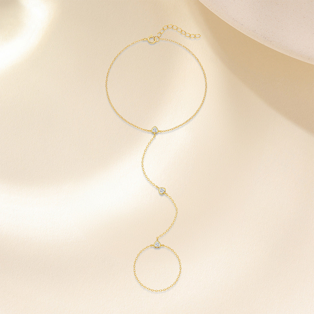 Gold plated 925 sterling silver hand chain bracelet with zirconia accents, adjustable finger bracelet design