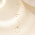 Gold plated 925 sterling silver hand chain bracelet with zirconia accents, adjustable finger bracelet design