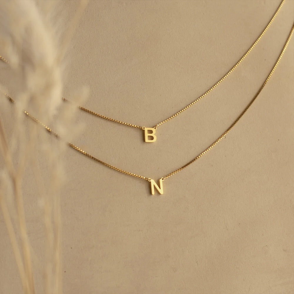 Gold plated stainless steel letter pendant necklace with 42+8 cm chain, minimalist initial jewelry for women.