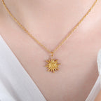 18K gold PVD plated stainless steel sun pendant necklace with geometric sun charm on fine chain.