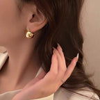 Chunky C-shaped gold plated stainless steel hoop earrings for women, high polish finish, 19 × 15 mm size.