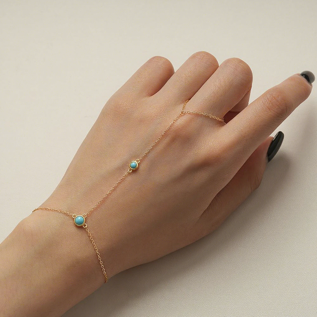 Gold plated 925 sterling silver hand chain bracelet with round turquoise stone and finger loop design