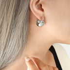 Chunky C-shaped gold plated stainless steel hoop earrings for women, high polish finish, 19 × 15 mm size.