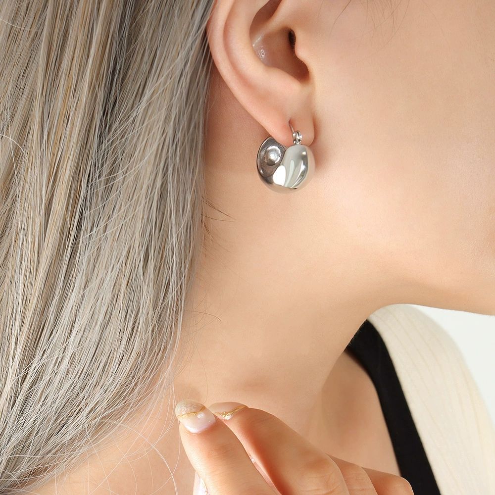 Chunky C-shaped gold plated stainless steel hoop earrings for women, high polish finish, 19 × 15 mm size.