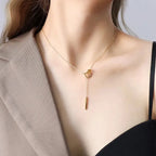 18K gold plated stainless steel geometric tassel pendant necklace with hollow square design and adjustable link chain on white background