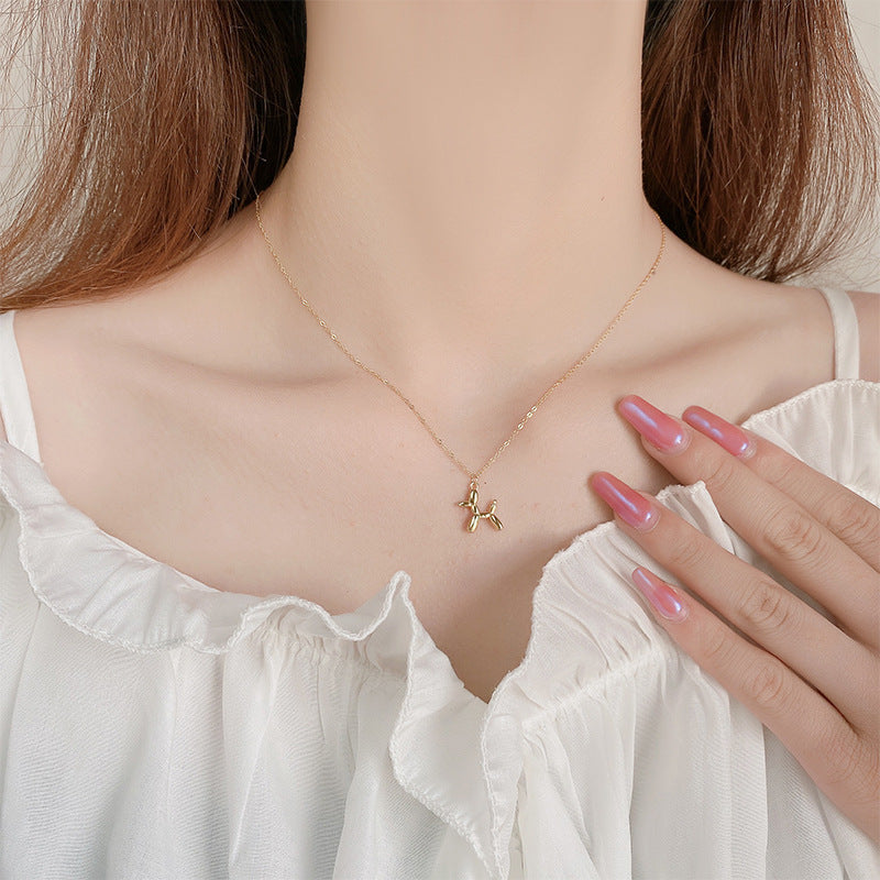 18K gold plated stainless steel balloon dog pendant necklace with cute animal design on a link chain, unisex jewelry on white background