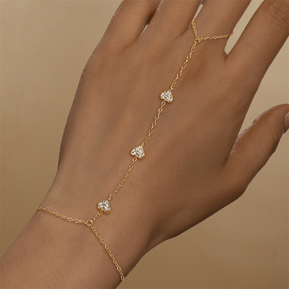 Gold plated 925 sterling silver hand chain bracelet with zirconia accents, adjustable finger bracelet design