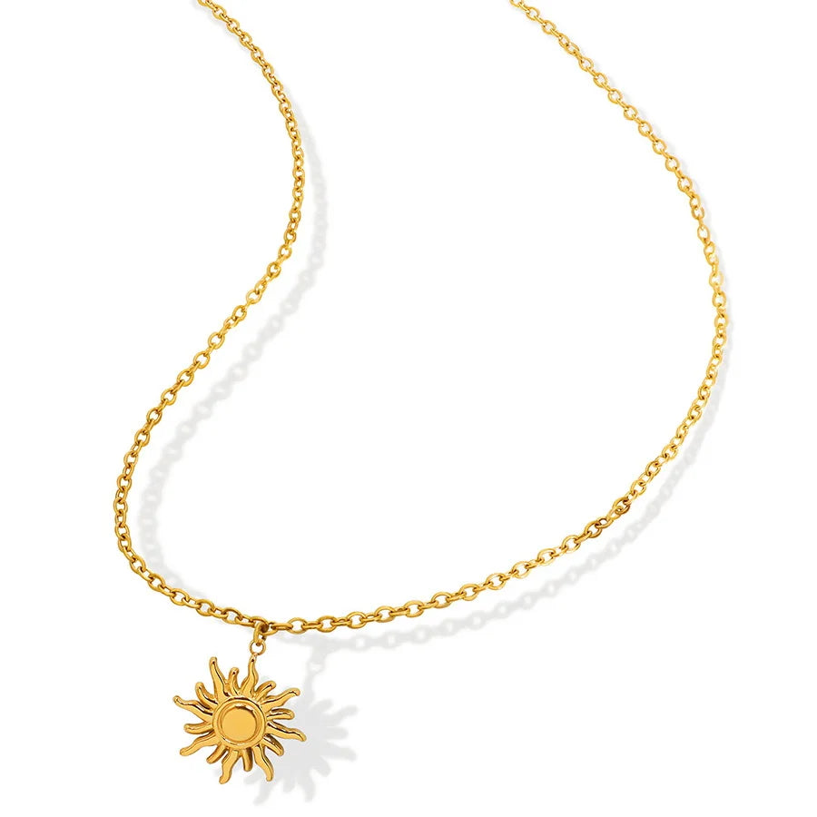 18K gold PVD plated stainless steel sun pendant necklace with geometric sun charm on fine chain.