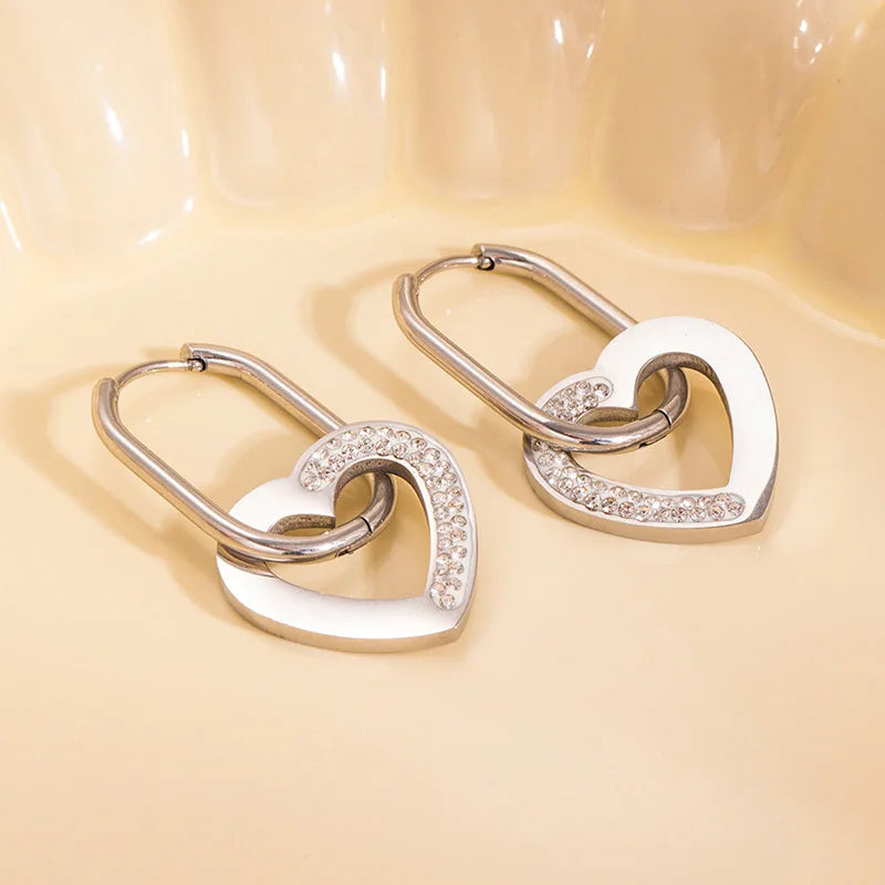 Gold plated stainless steel heart hoop earrings with zircon accents, geometric heart design, 3.6 × 1.9 cm size.