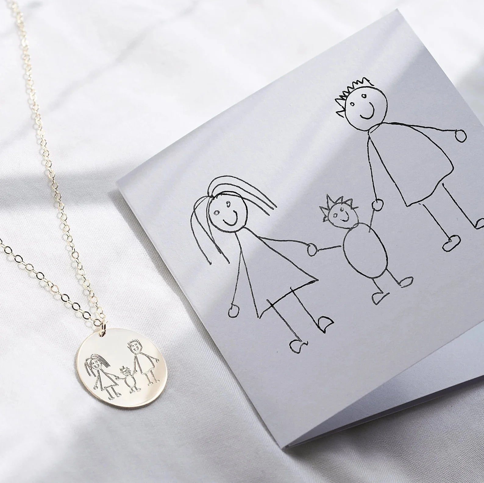 Personalized child’s drawing necklace made from kids artwork in stainless steel