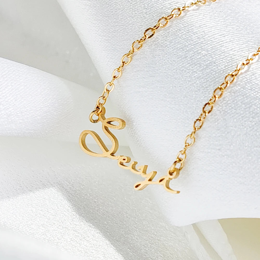 Custom stainless steel initial name necklace with 14K gold or silver plating on a link chain, personalized letter choker for women.