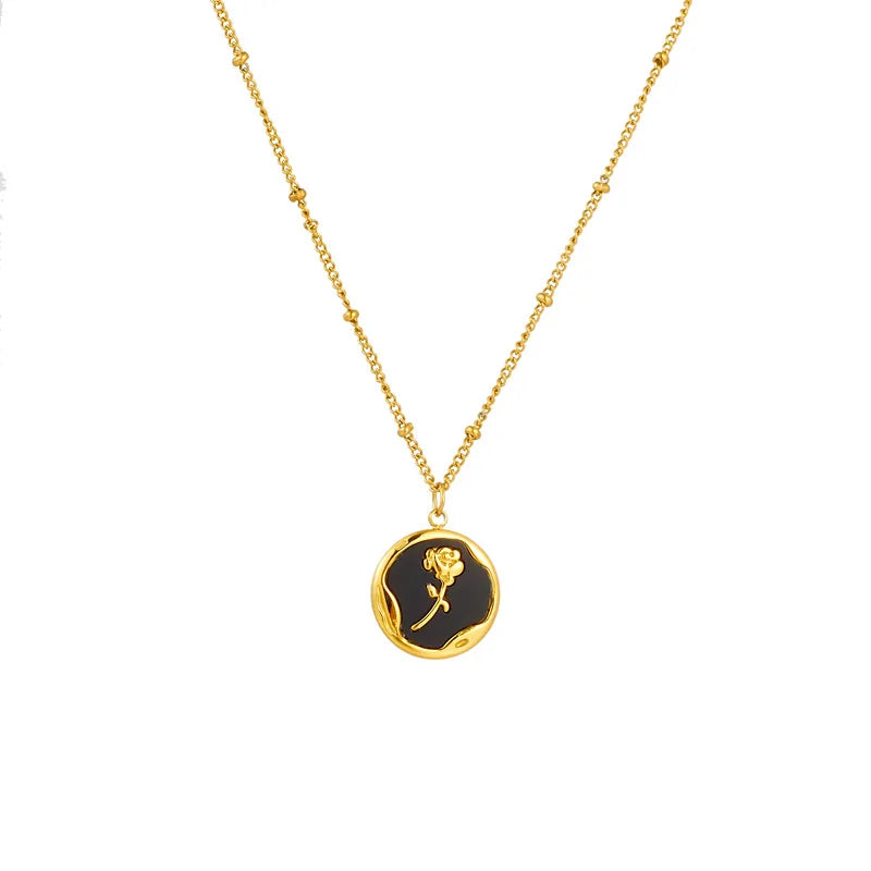 Gold PVD plated stainless steel necklace with round zircon flower pendant, minimalist floral design displayed on chain.