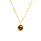 Gold PVD plated stainless steel necklace with round zircon flower pendant, minimalist floral design displayed on chain.