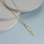 Personalized stainless steel handwritten vertical name necklace with custom letter pendant, adjustable 15.7–17.7 inches chain, gold finish shown on hand.