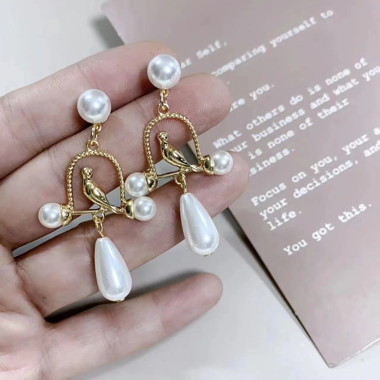 Retro palace-style long pearl drop earrings with vintage statement design for women