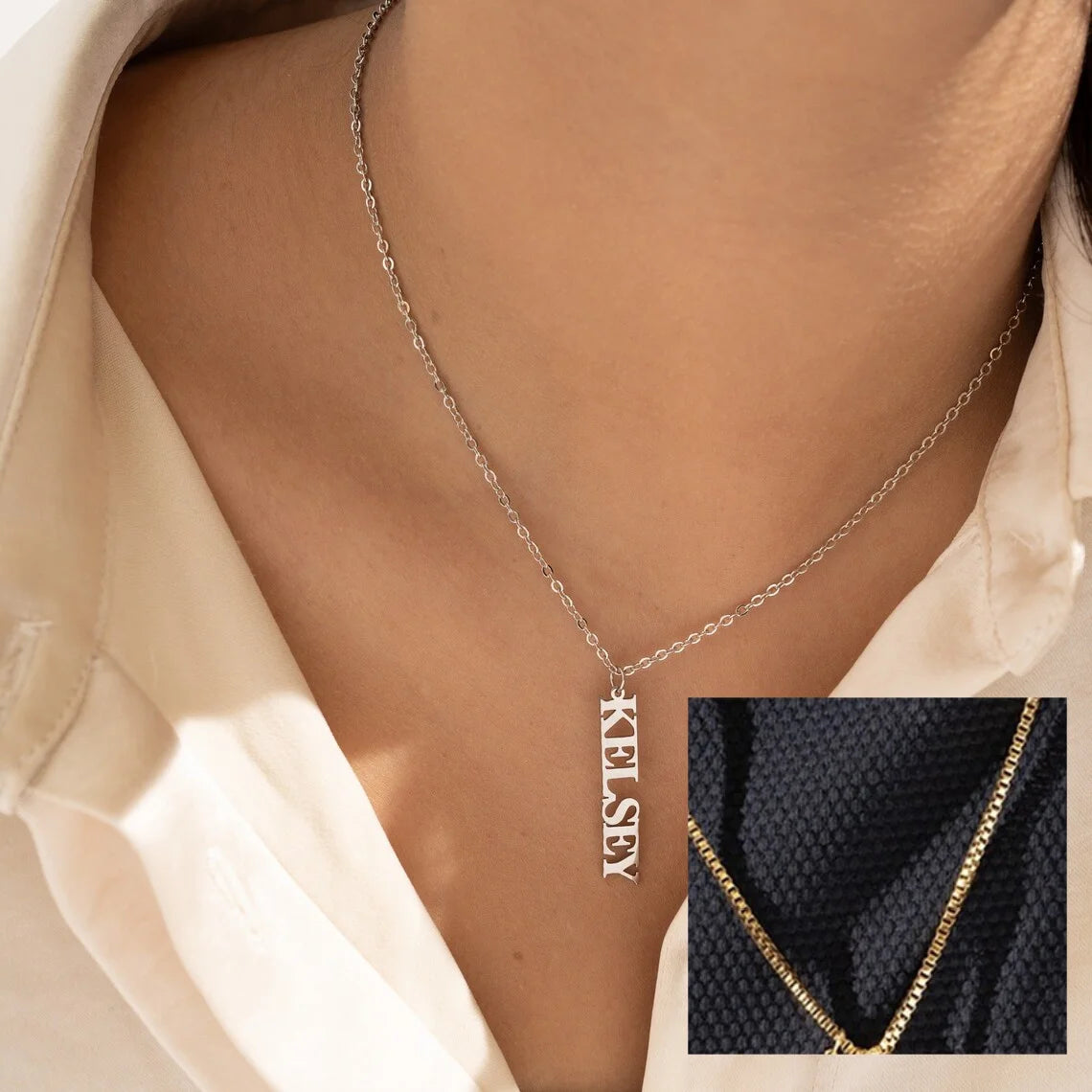 Personalized vertical name necklace in stainless steel with multiple custom name pendants, adjustable 40+5 cm chain, gold finish shown on model.