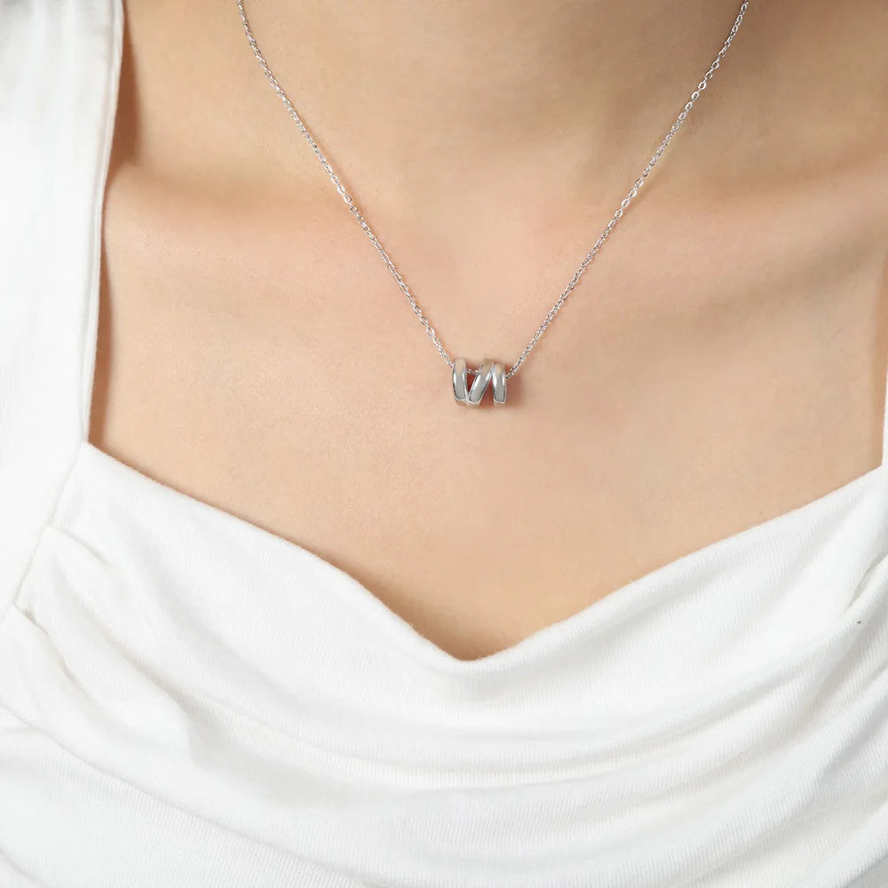 18K gold plated stainless steel geometric hollow pendant necklace with bead chain, adjustable unisex jewelry on white background